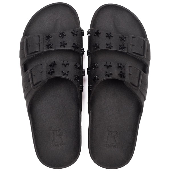 sandales noires avec clous en forme d'étoile cacatoès vues de haut